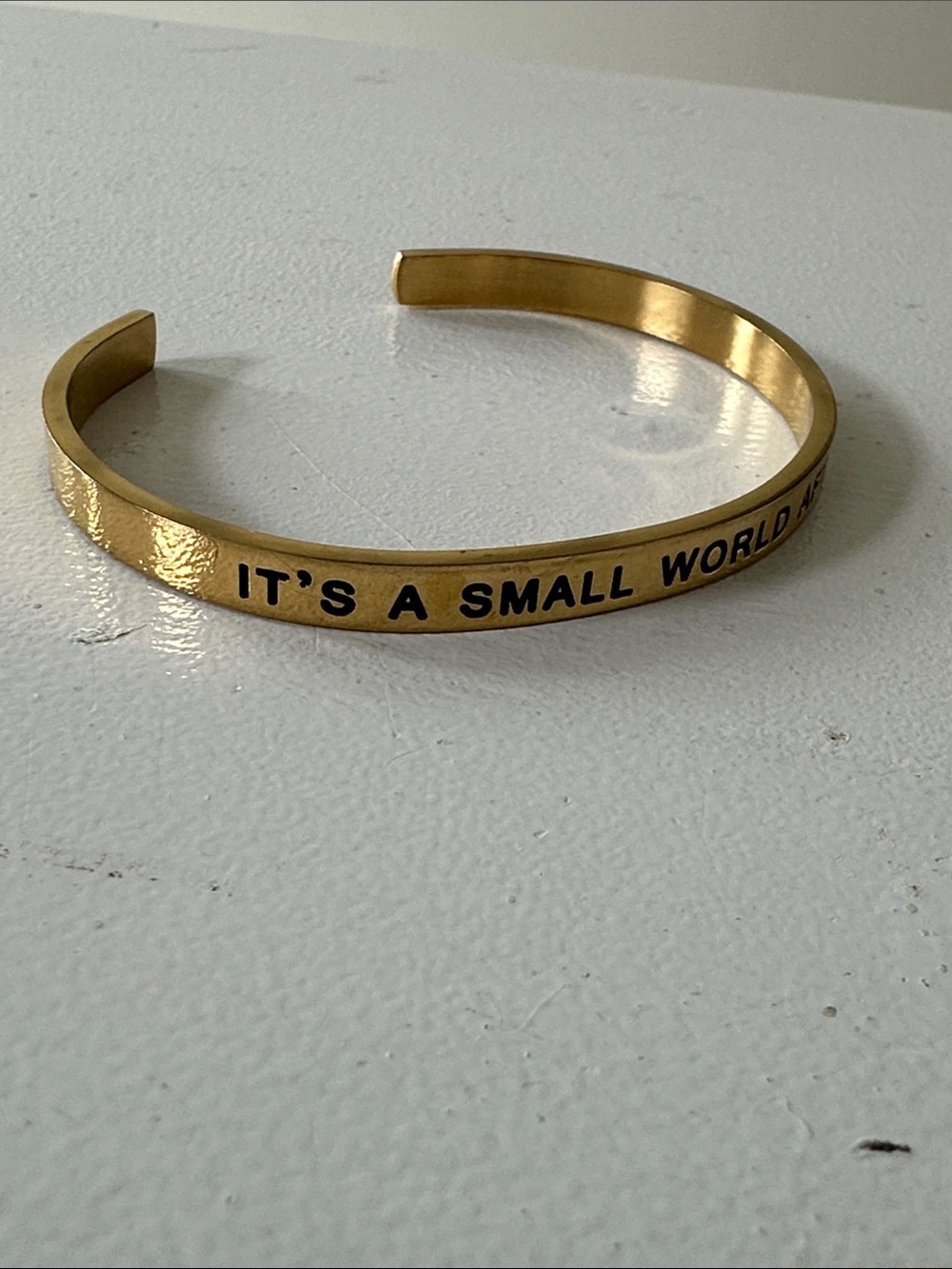 Gold Tone Cuff Bracelet "IT'S A SMALL WORLD After all “